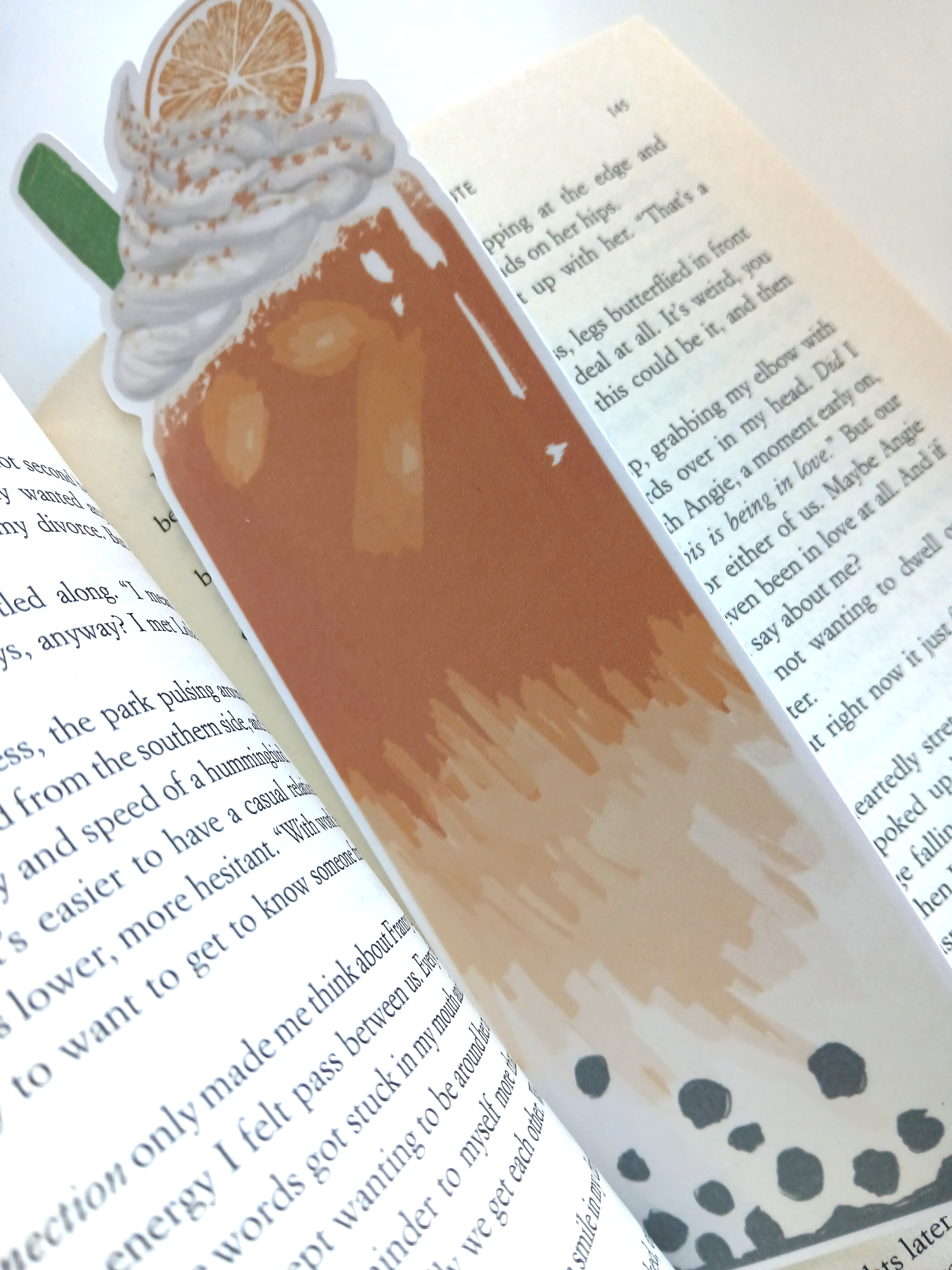 orange bookmark with book.png