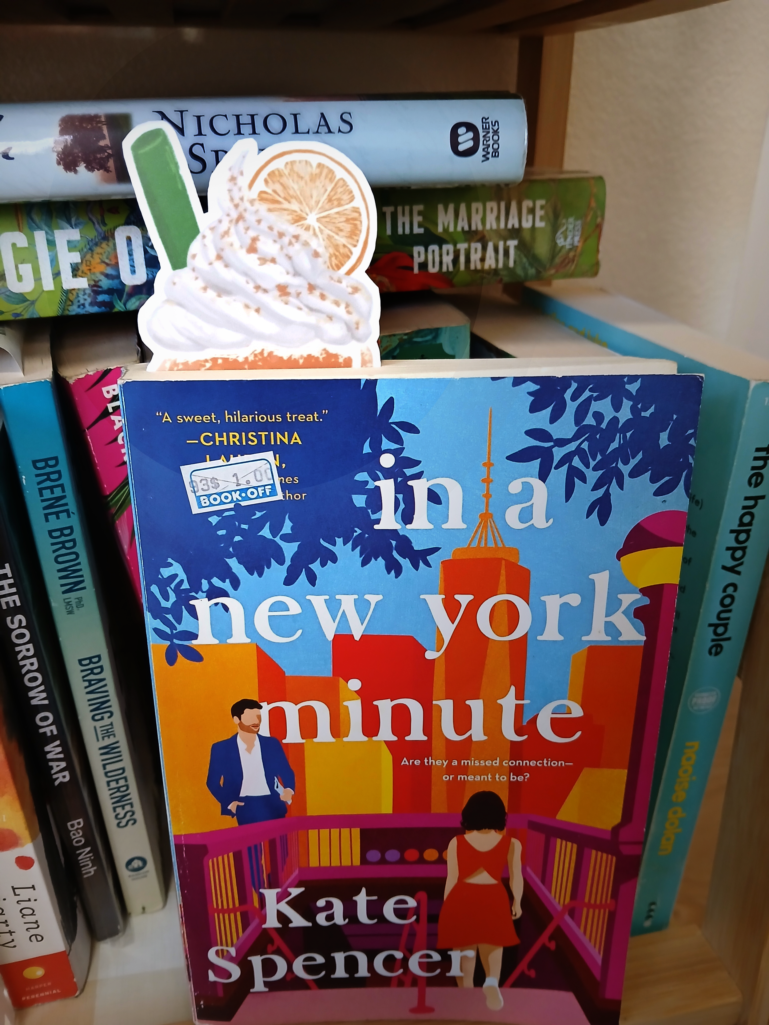 orange boba bookmark in book.png