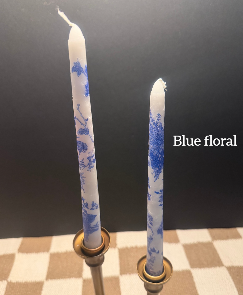 Blue floral taper candle.png