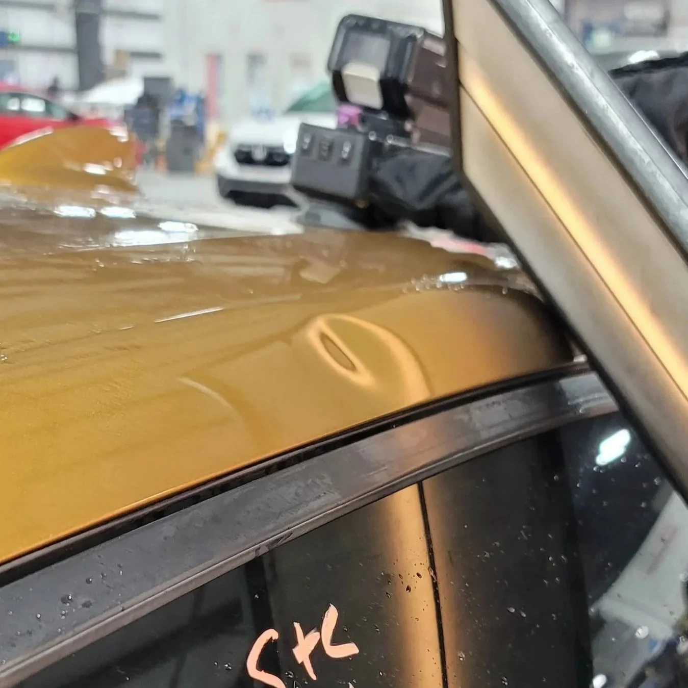 Medium Roof Rail Dent example in Tiger Eye Pearl Acura TLX; Paintless Dent Removal via Glue Pulling Only starting $200 at Tigerroad Auto Protection LLC