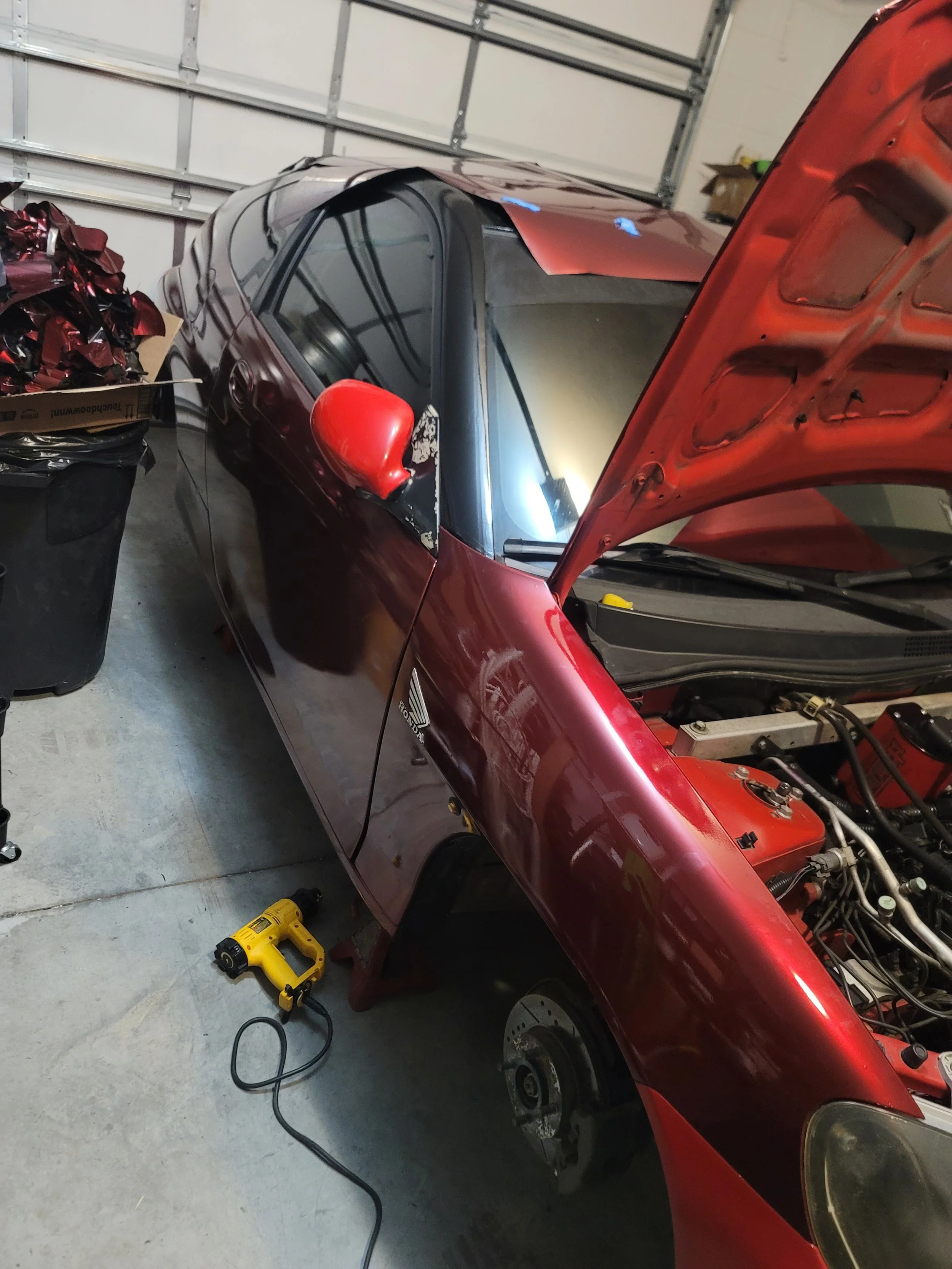 Full Vehicle Wrap in Process at Tigerroad Auto Protection with Vinyl Frog GMP31/PET Glossy Metallic Rosewood Red