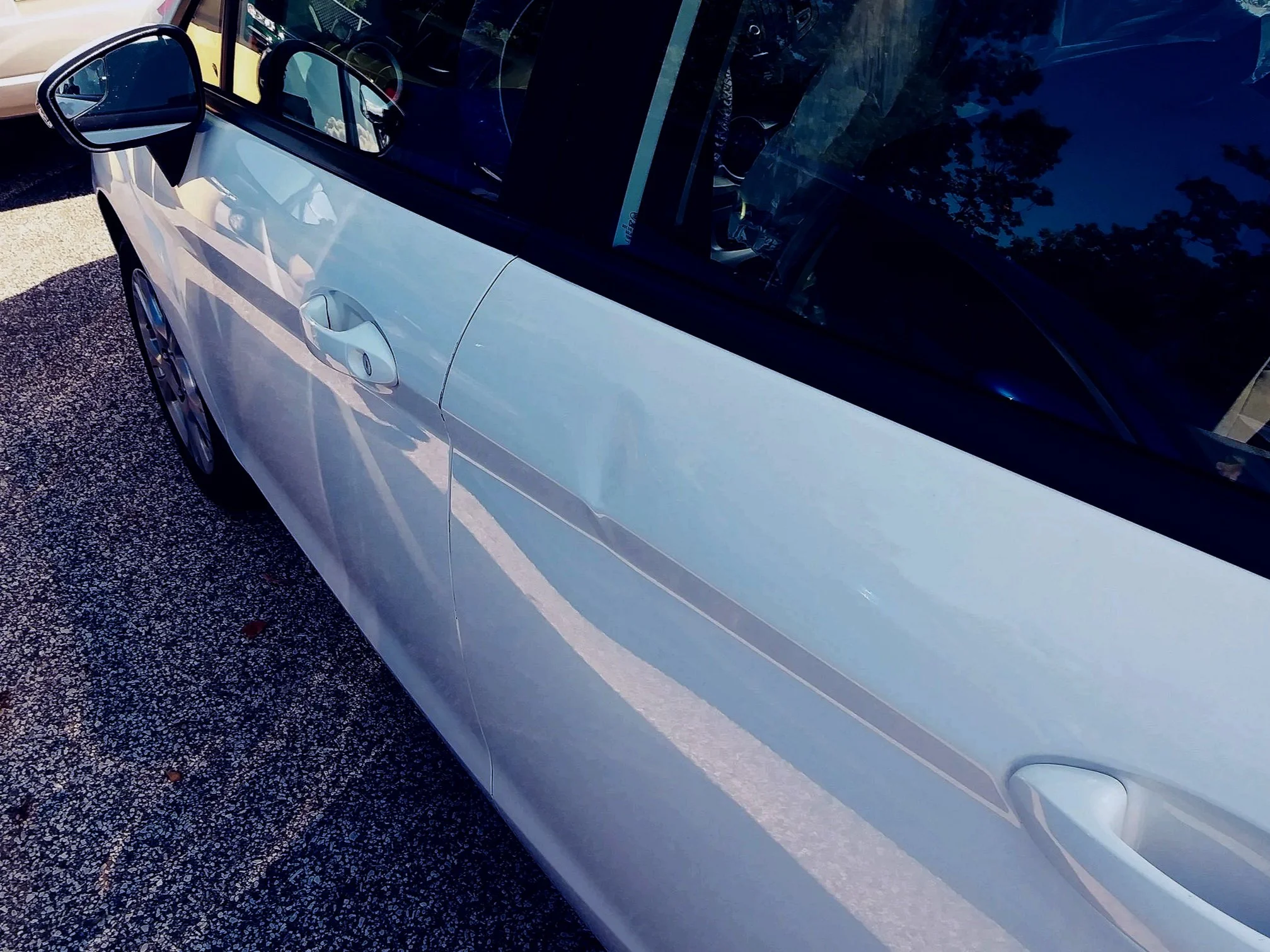 Crowned Bodyline also known as Advanced Bodyline Dent example in Kia/Hyundai Driver rear Door, Paintless Dent Removal starting $160 at Tigerroad Auto Protection LLC