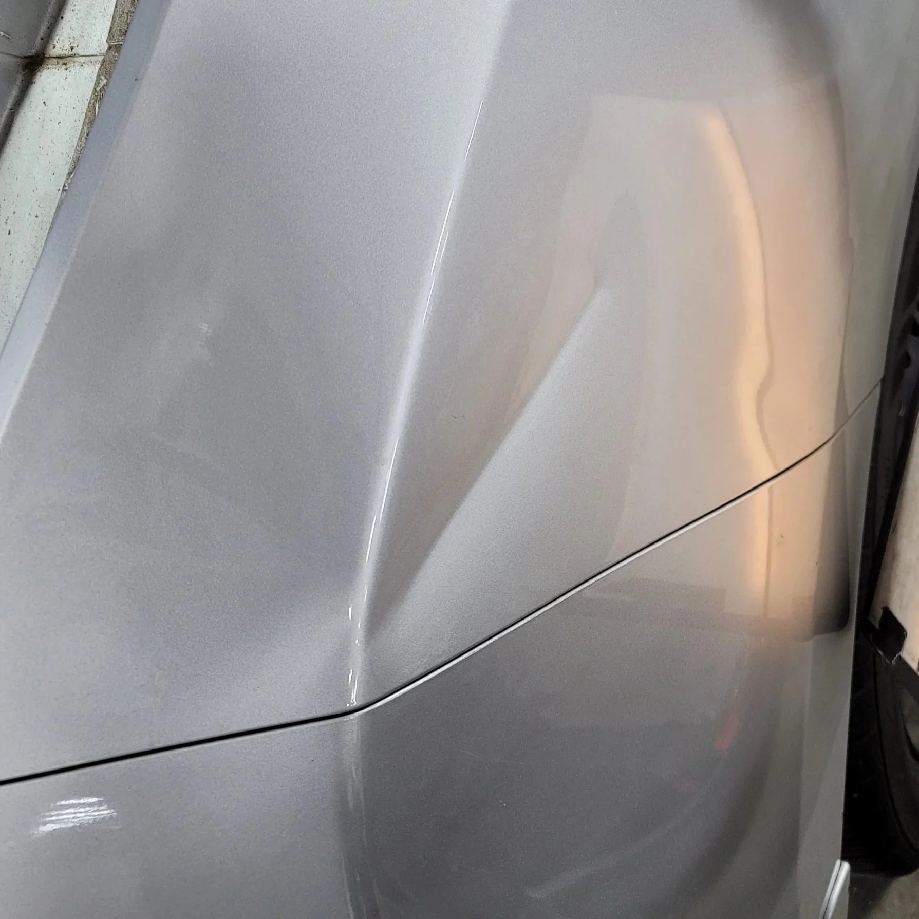 Crease example in Nissan Leaf Passenger Quarter; Paintless Dent Removal starting $180 at Tigerroad Auto Protection LLC, this particular example would be $250
