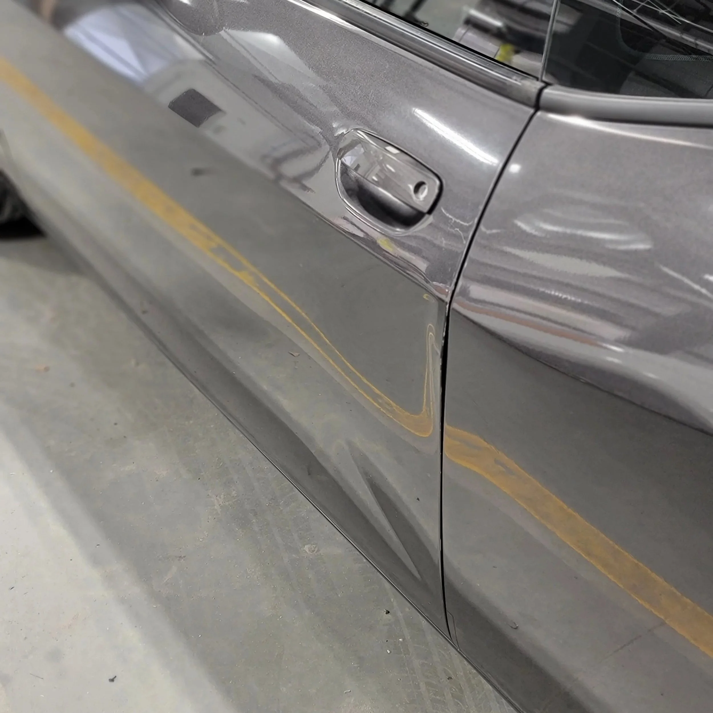 Dodge Challenger with Driver Door Half Panel Damage; Paintless Dent Removal starting $300 at Tigerroad Auto Protection LLC