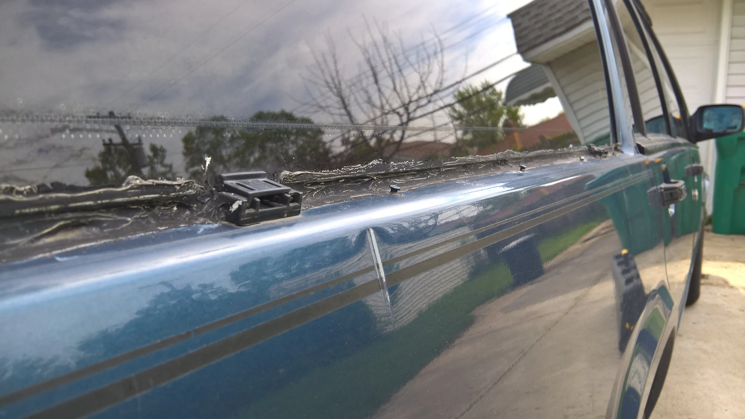 Crease dent qualifying as an Advanced Dent example in 1989 Volvo 740 GLE Wagon Passenger Quarter Panel; Paintless Dent Removal starting $80 at Tigerroad Auto Protection LLC