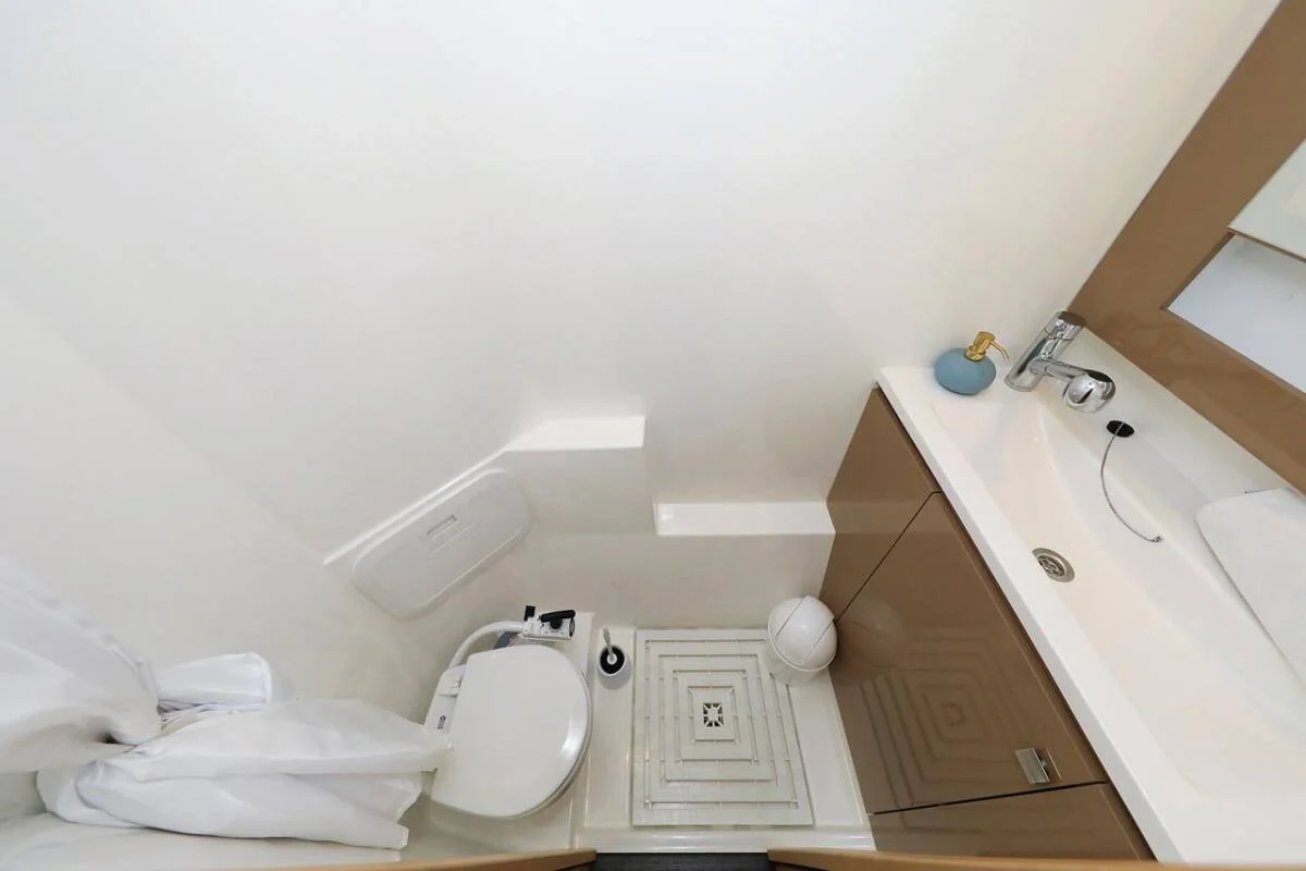 Guest head and bathroom on the Sovereign Charters yacht — high-end finishes for VVIP charter guests