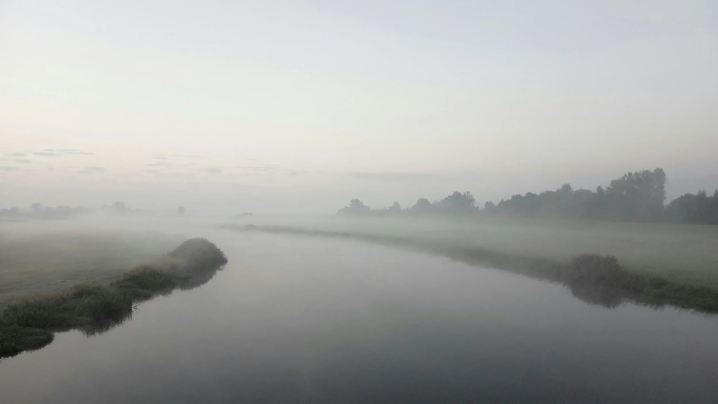 Morning fog lifting over a river representing hope, healing, and emotional freedom through EMDR therapy