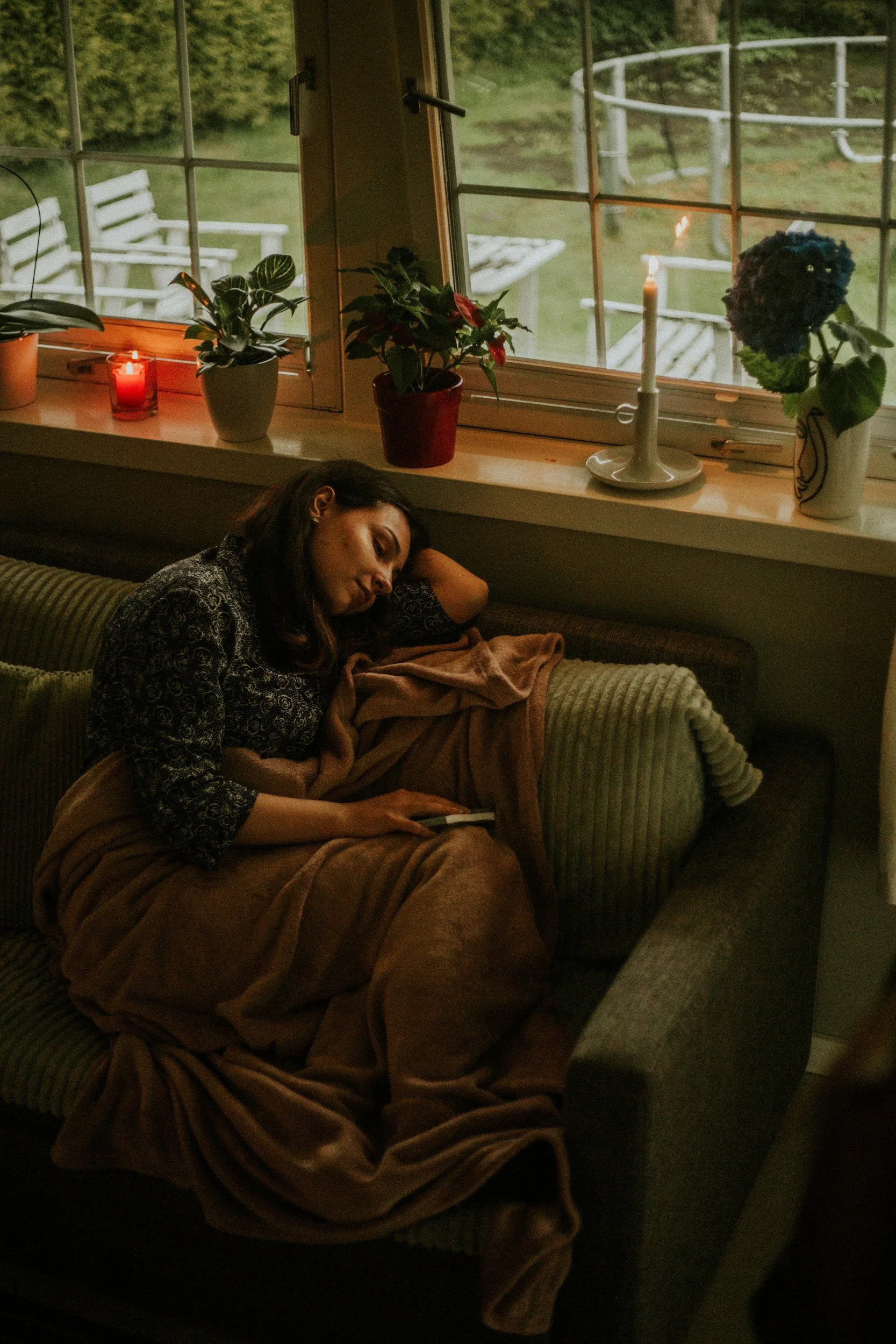 Woman reconnecting with her body during a calming somatic therapy session focused on nervous system regulation