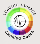 A circular logo with the words 'Leading Humans' at the top and 'Certified Coach' at the bottom. The circle has a gradient from green to yellow to red, with a black heart rate line inside.
