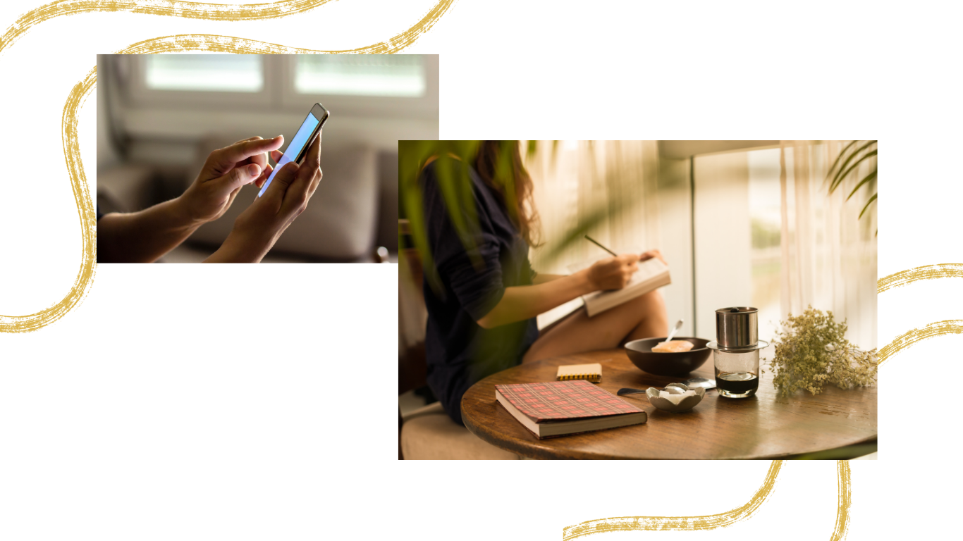 A person sitting at a wooden table, writing in a notebook with a cup of coffee, a bowl of food, a glass of water, and a plant nearby; another person using a smartphone in the background.