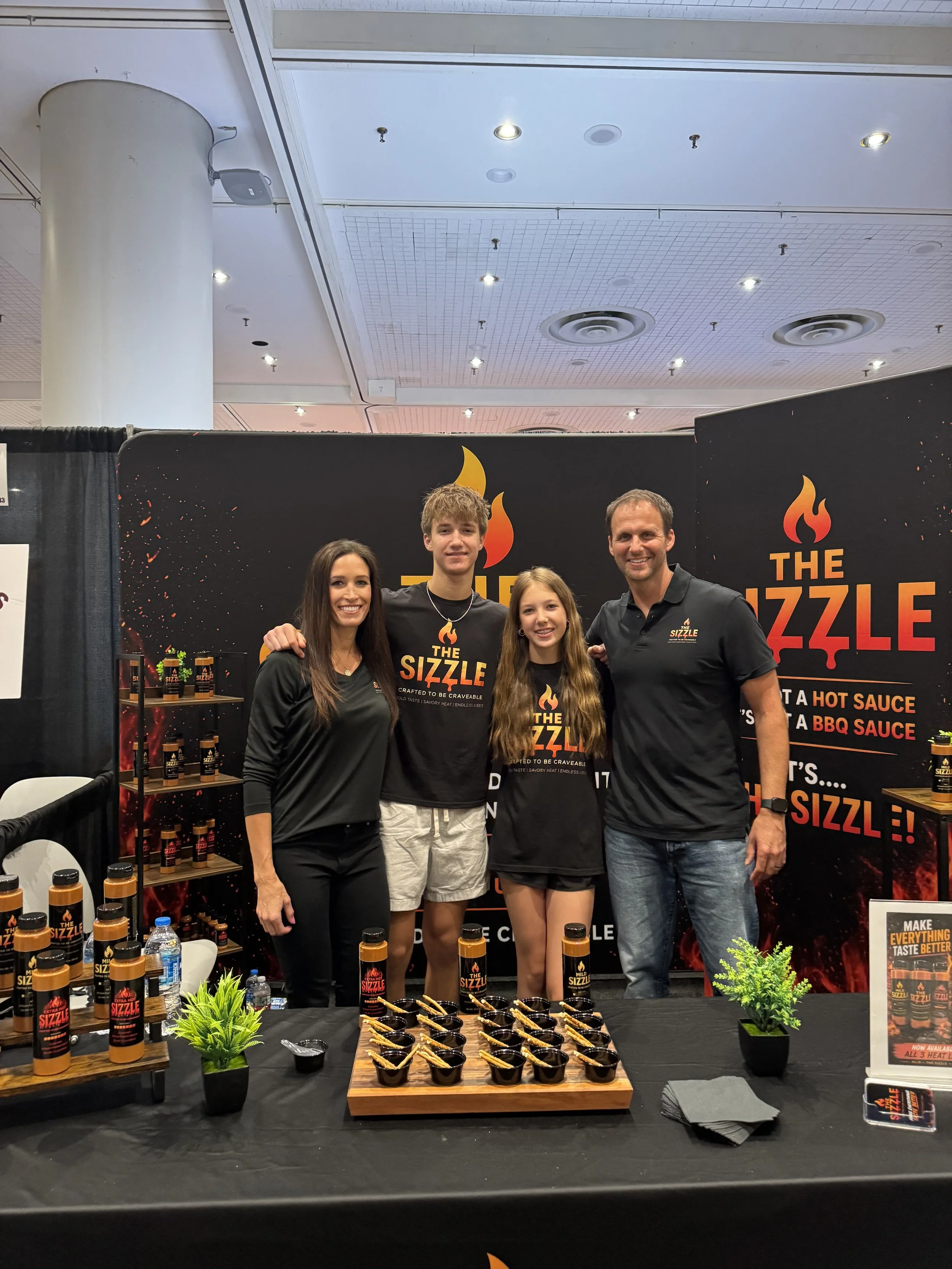 The Sizzle Sauce family at the summer fancy food show in New York