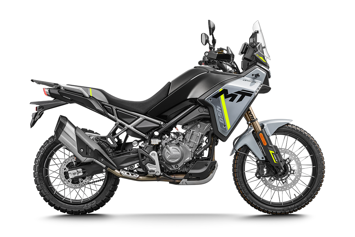 A black and gray adventure motorcycle with yellow accents, large tires, windshield, and engine protection features.