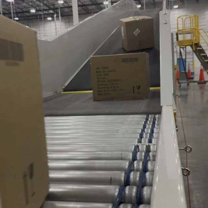 Boxes on a conveyor belt at an industrial facility.