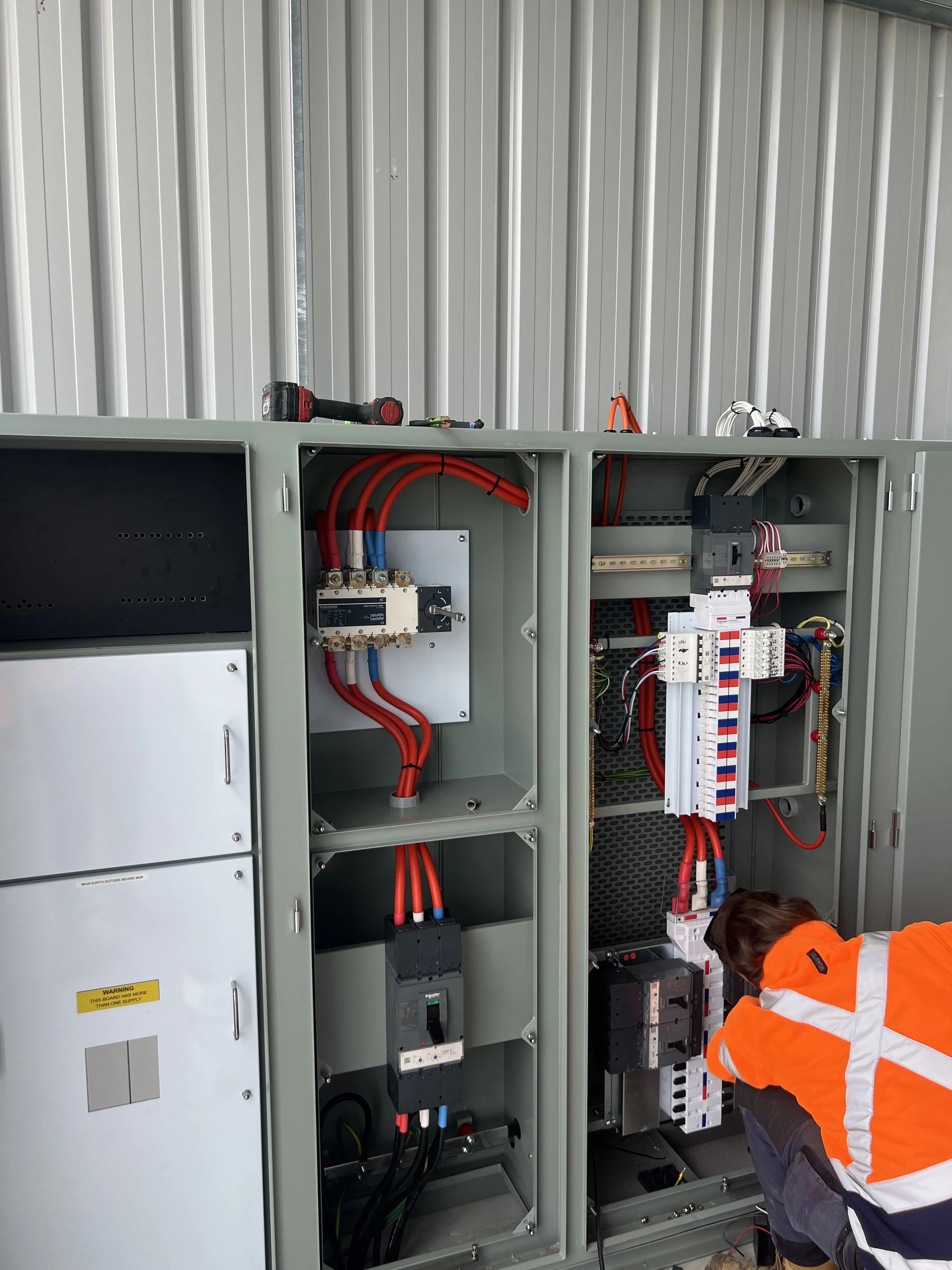 Electrician install 3 phase switchboard
