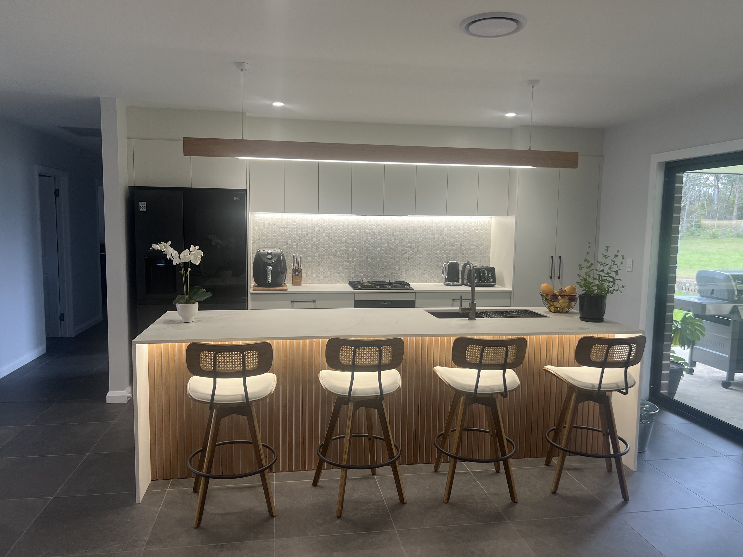 Modern kitchen with custom LED pendant lights, LED feature light, LED downlight, LED strip light