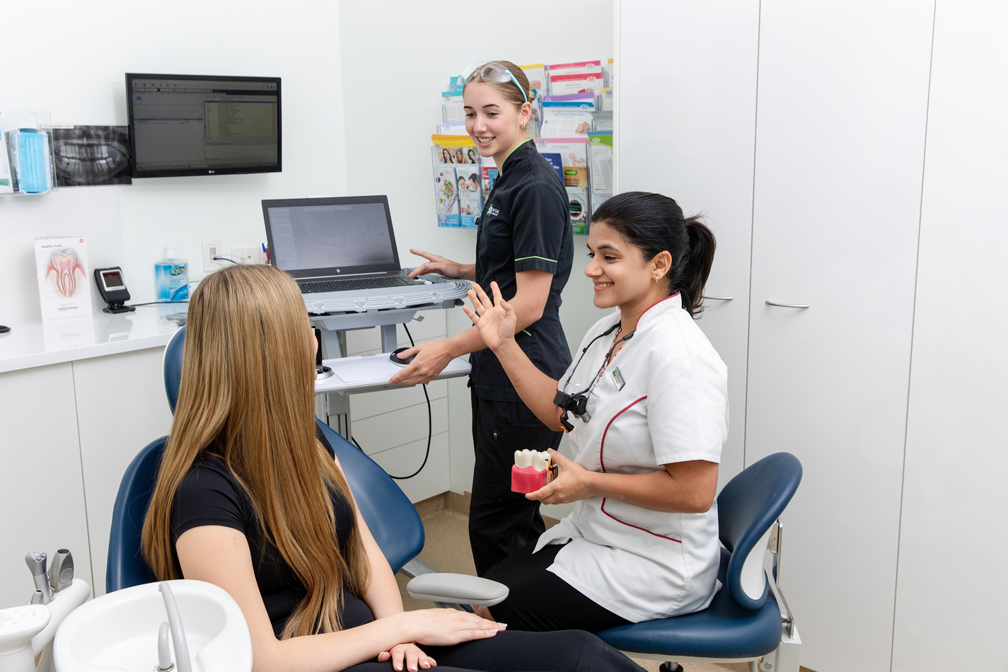Dr Shaily with the dental assistant and the patient