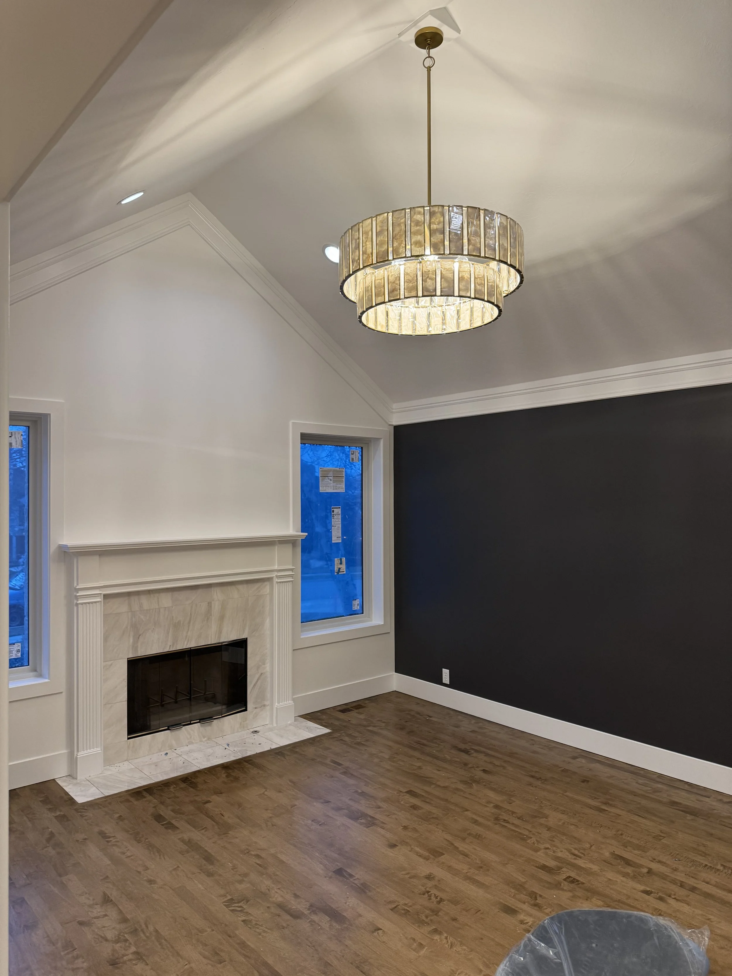 A new gold chandelier hanging from the ceiling.