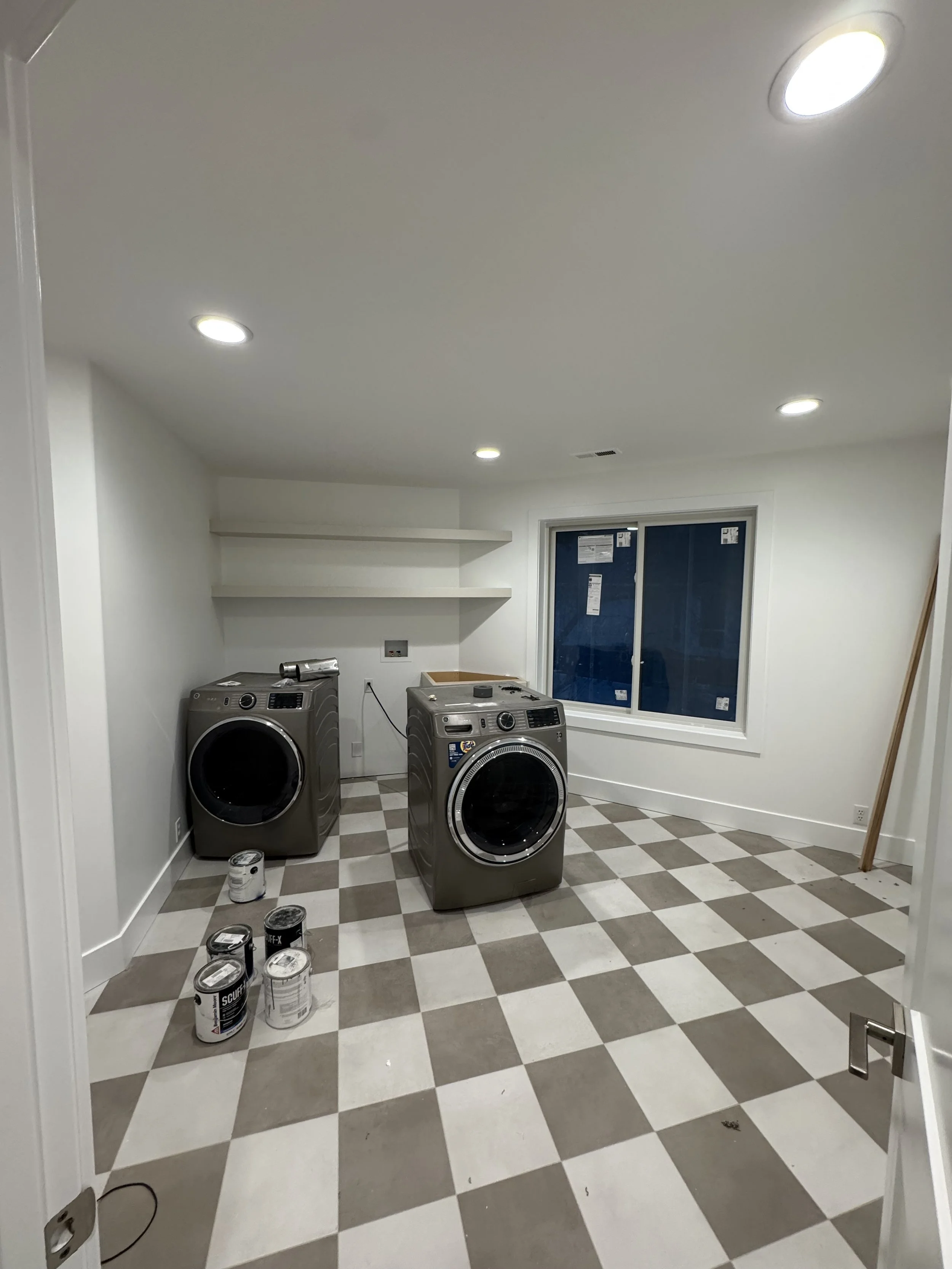 New can lights in this laundry room brings light to a usually dark space