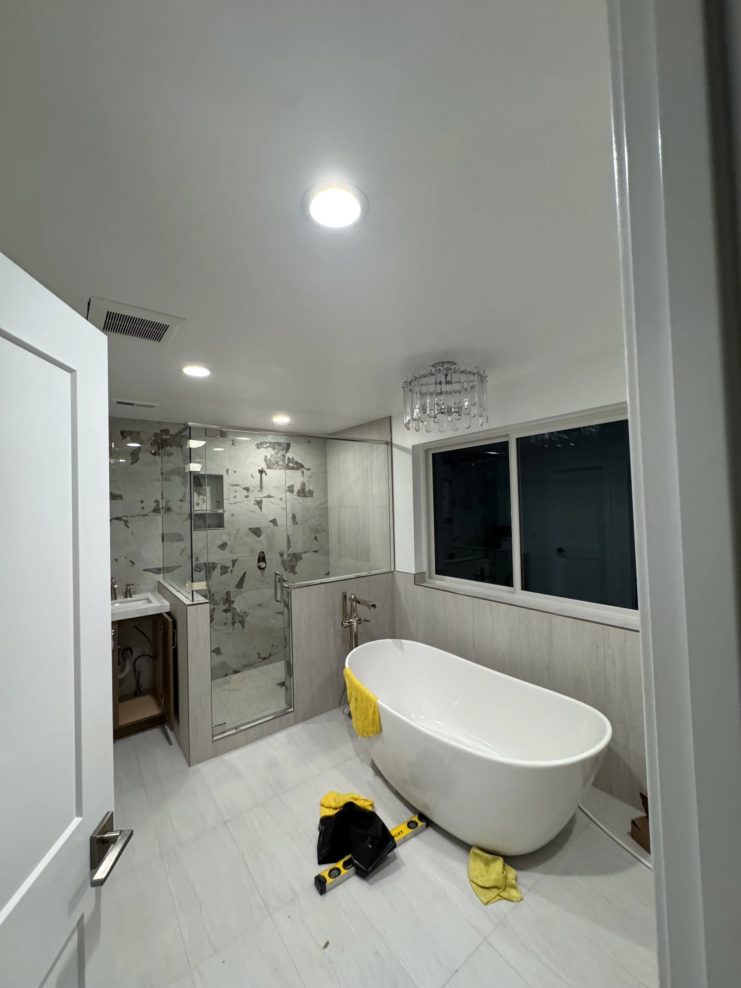 Modern bathroom with a white freestanding bathtub