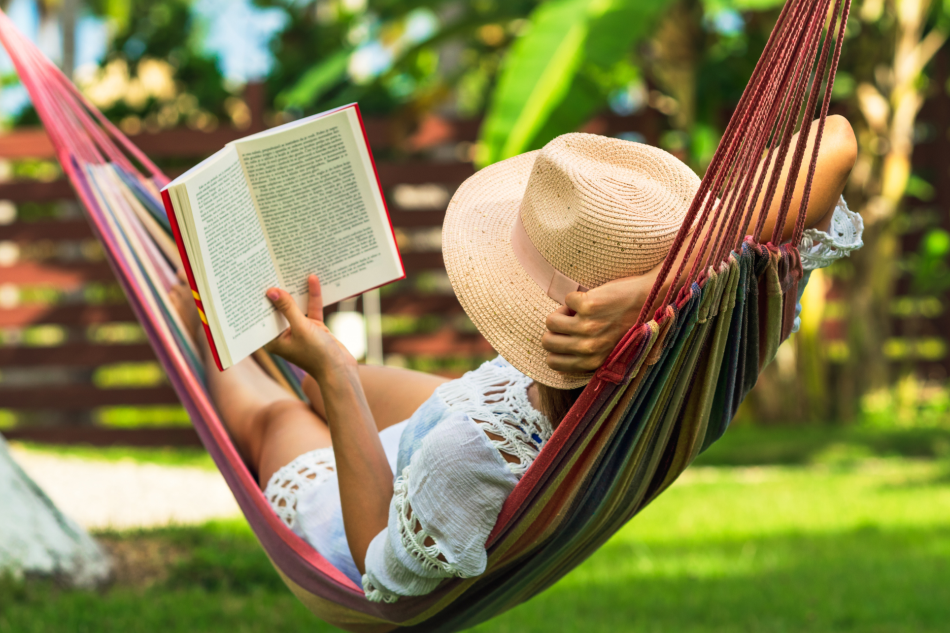 OnlyVibes Solo Vibe: A woman relaxing in a hammock outdoors, reading a book- enjoying me time. Display this vibe when embracing solitude and recharging your energy.