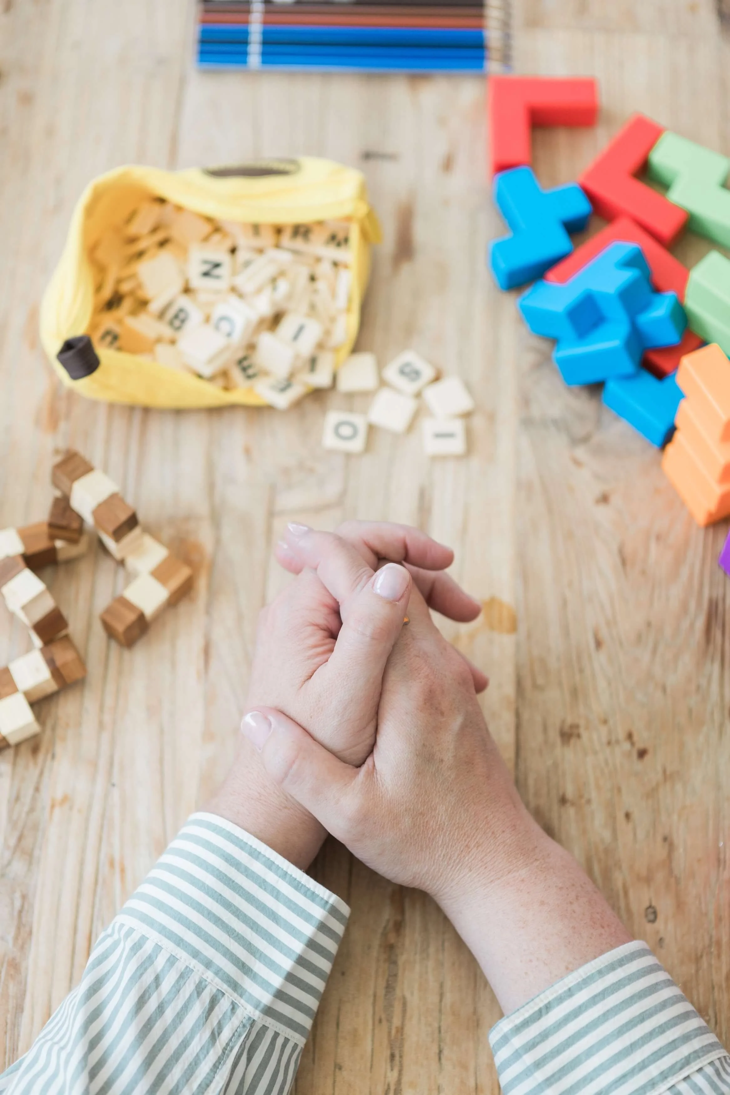 Child using building blocks during a therapy activity