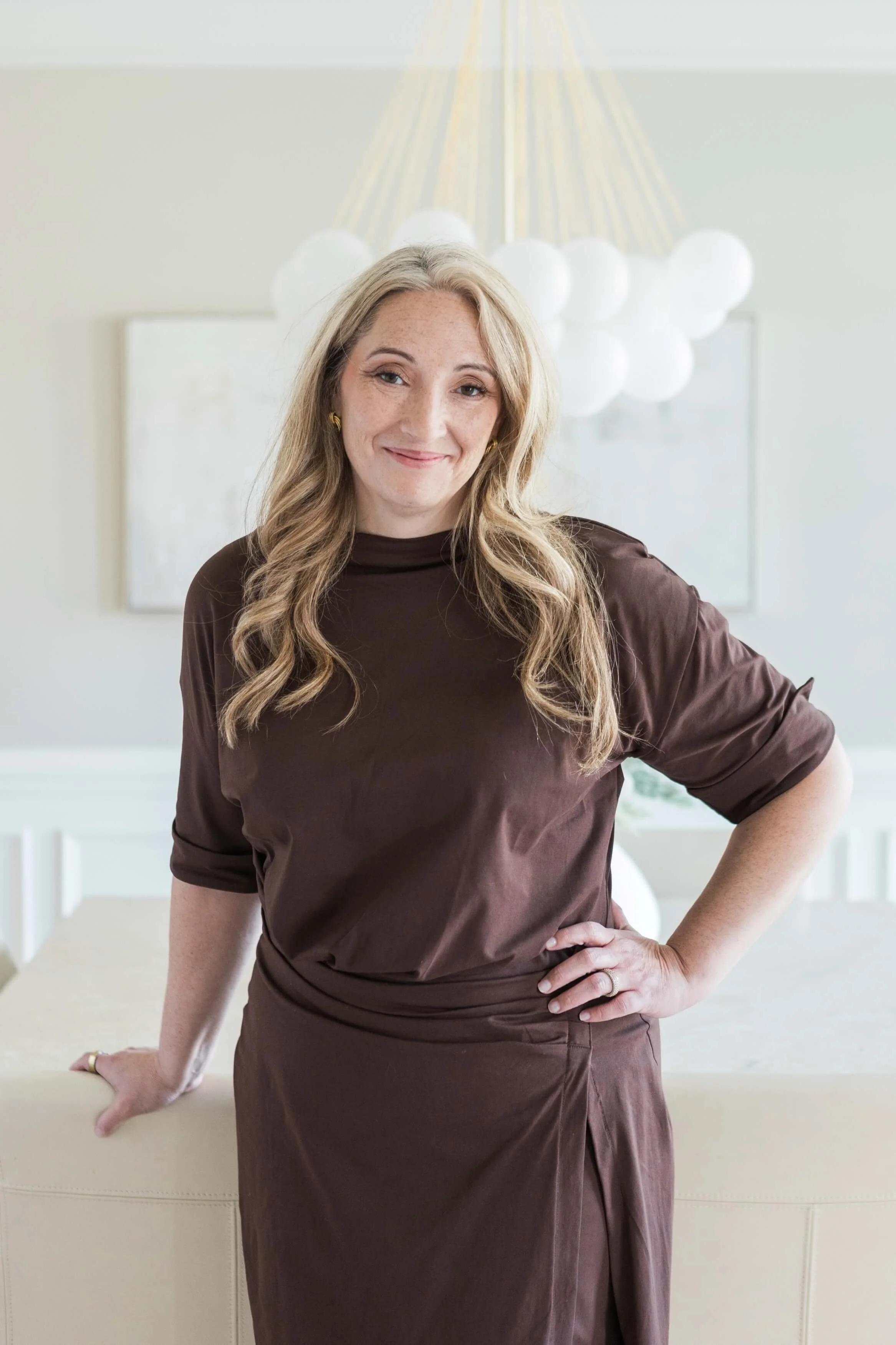 Northern Virginia therapist standing in a bright office