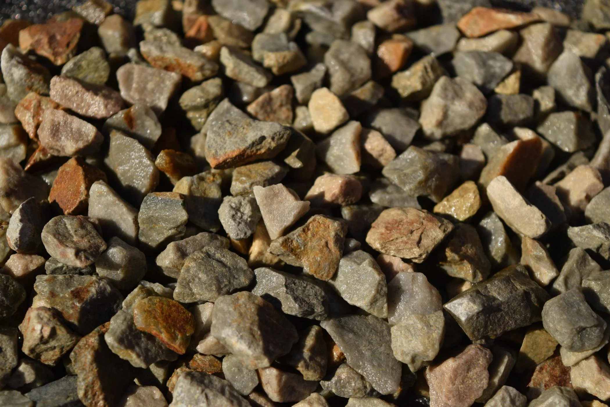 Close-up of small, irregularly shaped multicolored rocks or gravel.