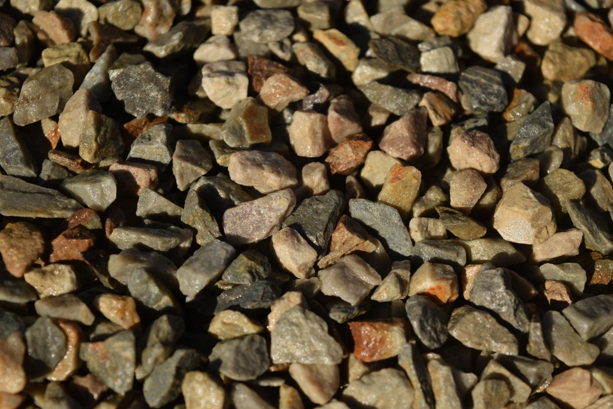 Close-up of small, irregularly shaped multicolored rocks or gravel.