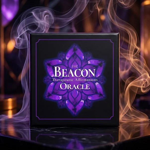 Black box with purple lotus flower design and text that reads "The Beacon Shadow Work Affirmation Oracle" surrounded by swirling smoke.