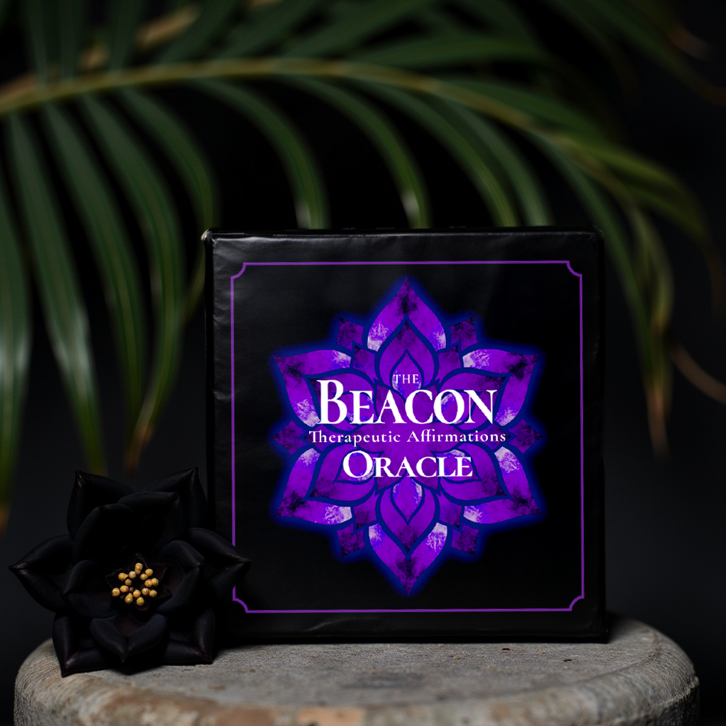 Beacon Oracle Deck box standing upright beside a flower on a stone with greenery background