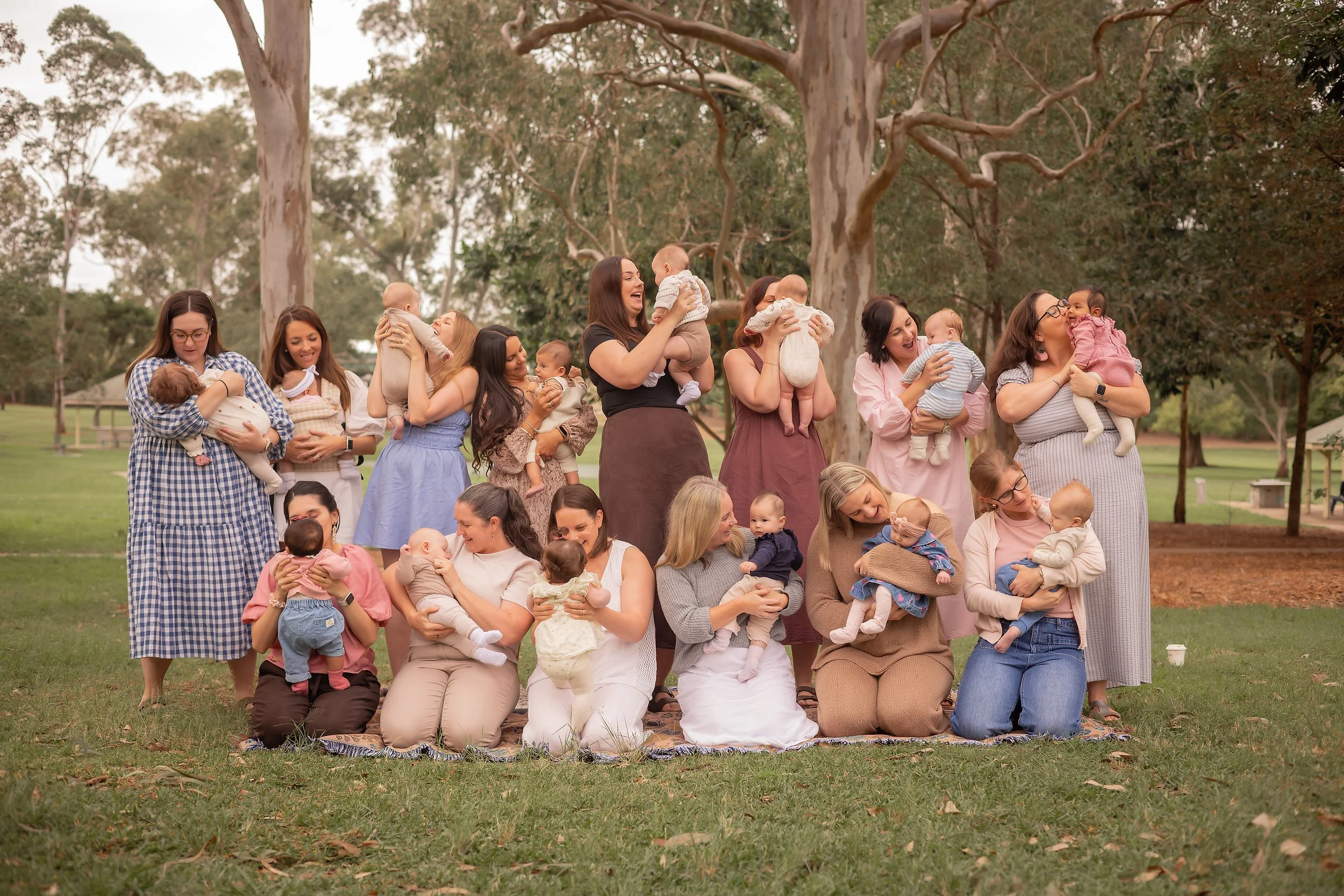 Postpartum mums celebrating together at the end of their mums group session in Everton Park.