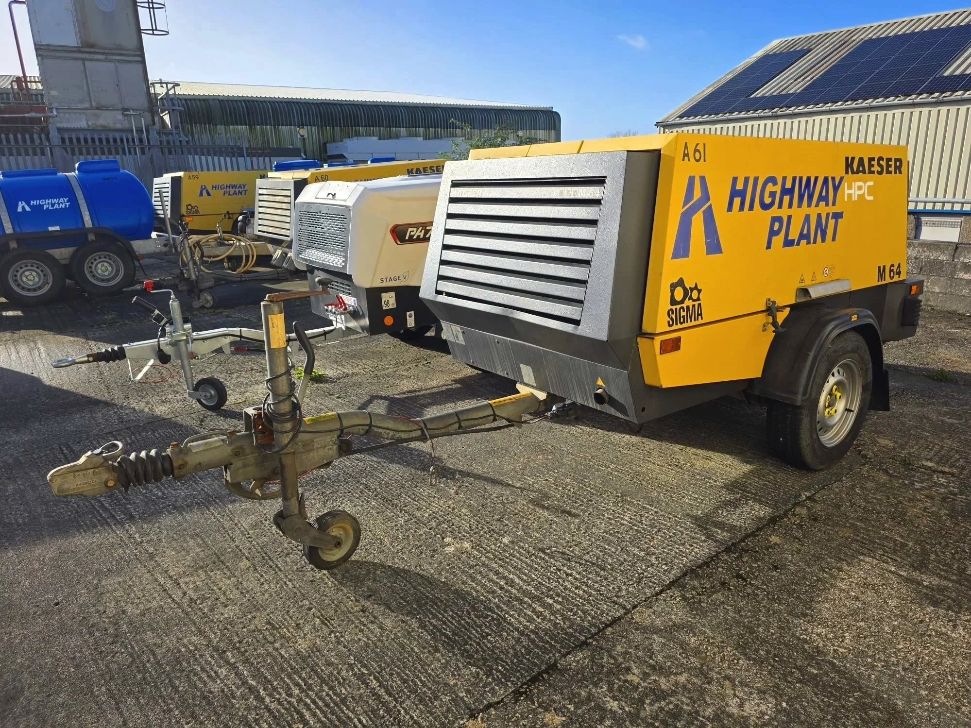 A yellow and black portable air compressor for hire in Cornwall and Devon