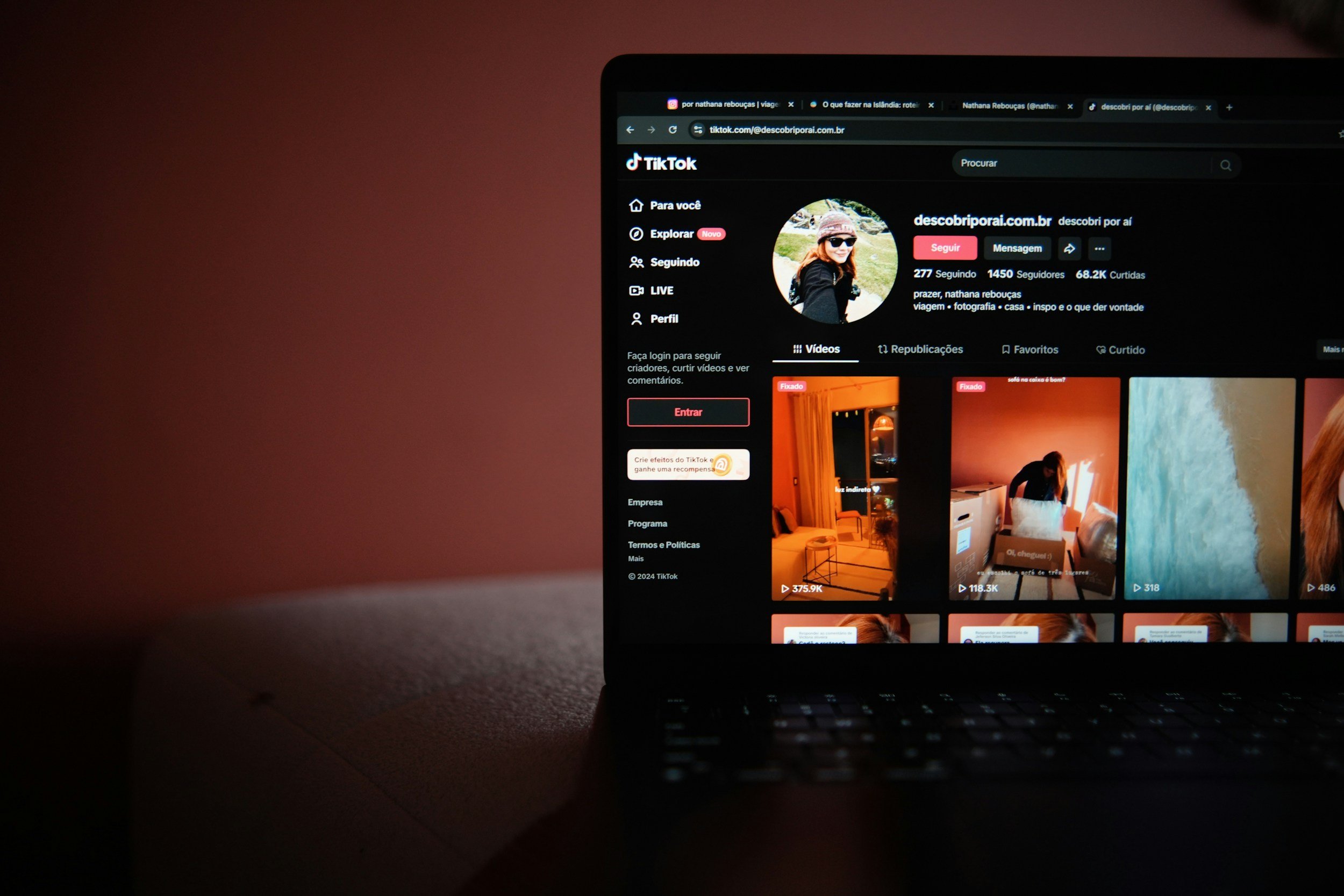 Computer screen displaying a TikTok profile page with a profile picture of a woman wearing sunglasses and a hat, and several video thumbnails below.