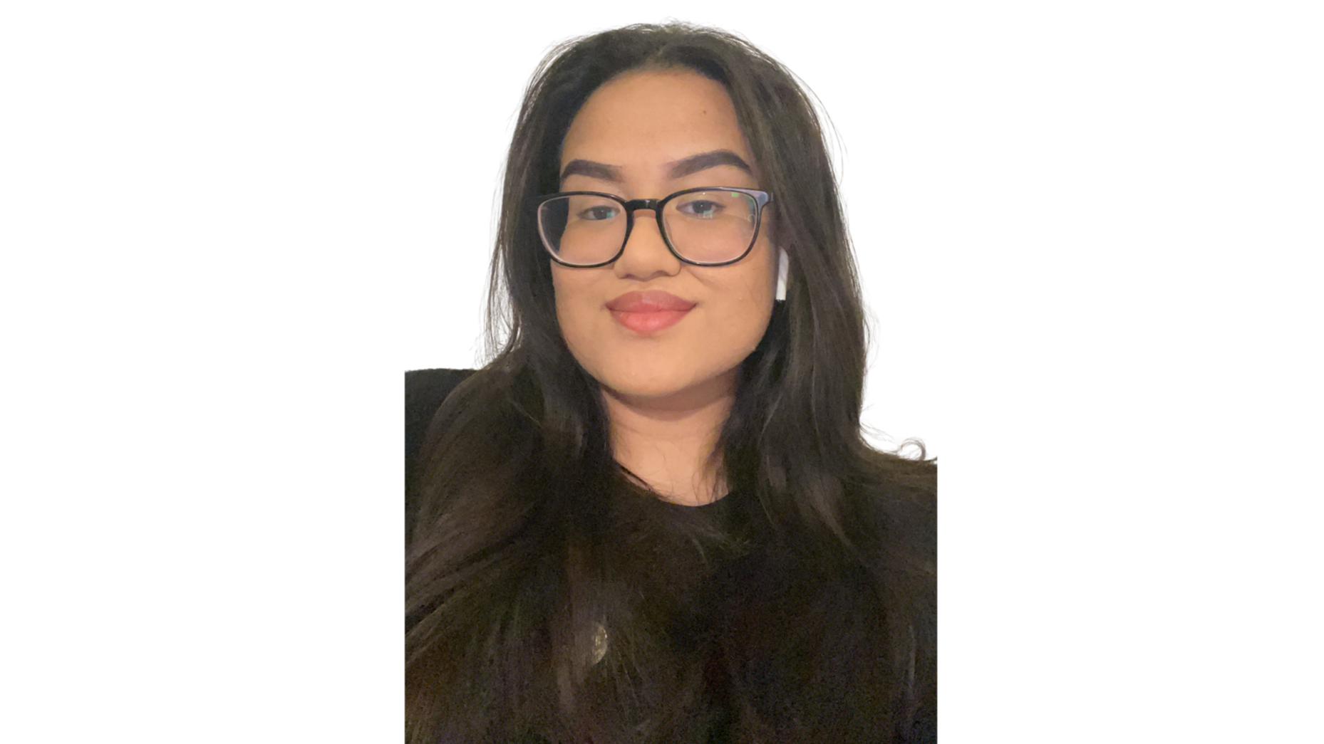 A woman with long dark hair, glasses, and AirPods, smiling at the camera against a plain background.