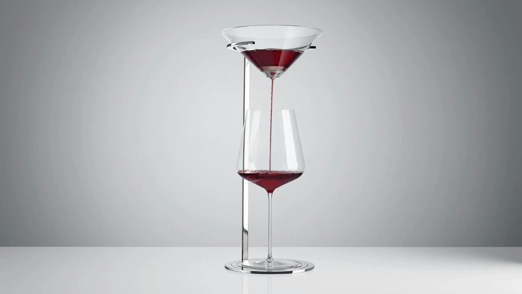 A modern wine decanter pouring red wine into a wine glass