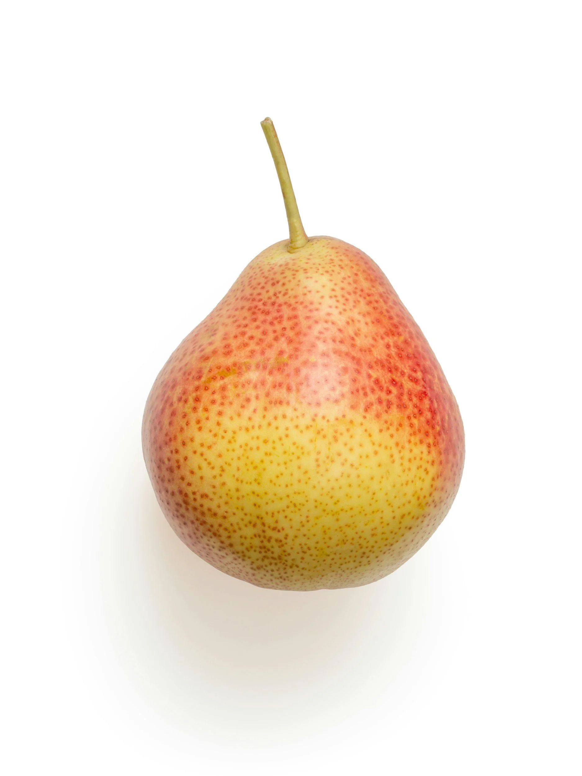 Ripe yellow and red pear on a clean white background