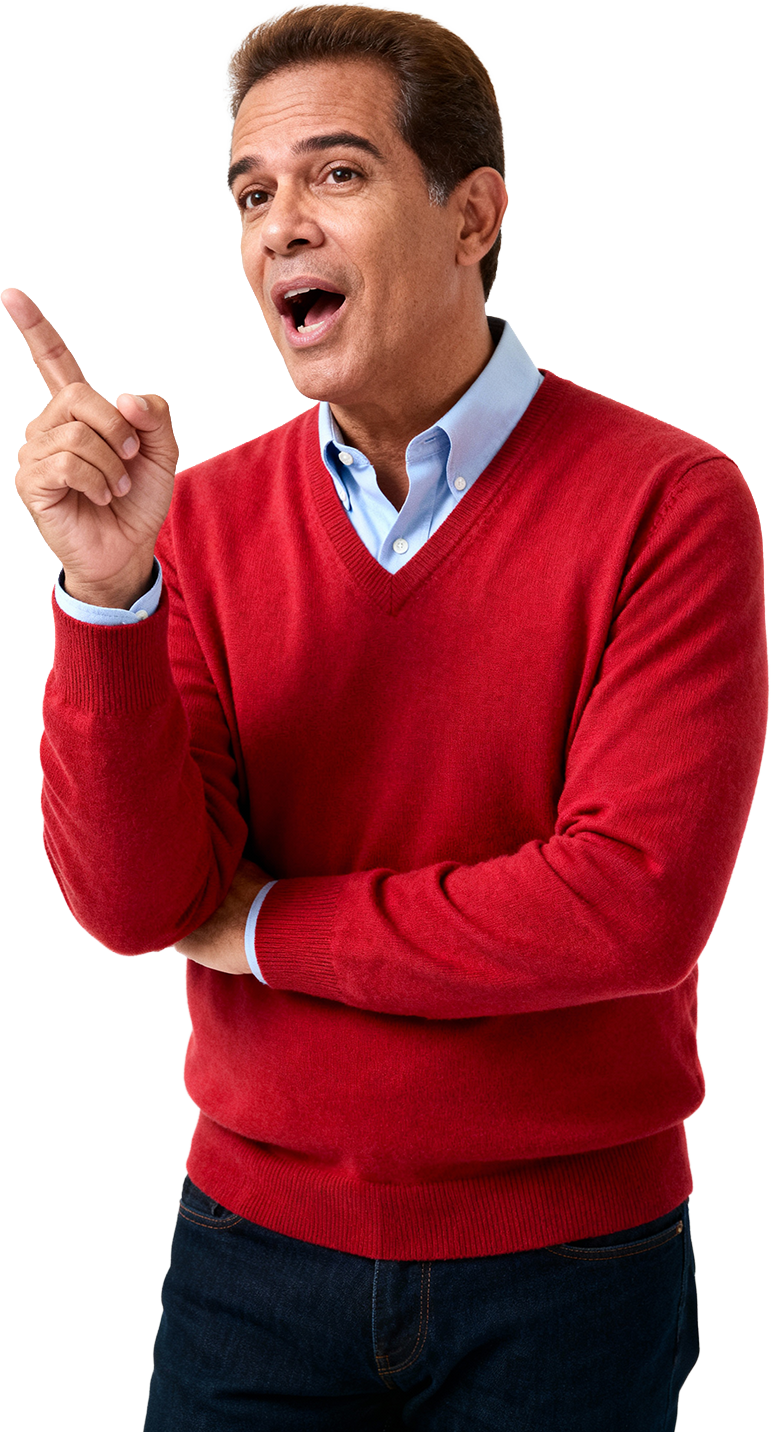 Homem de cabelo castanho claro, vestindo suéter vermelho e camisa azul clara, fazendo um gesto com a mão enquanto fala, com expressão facial animada.