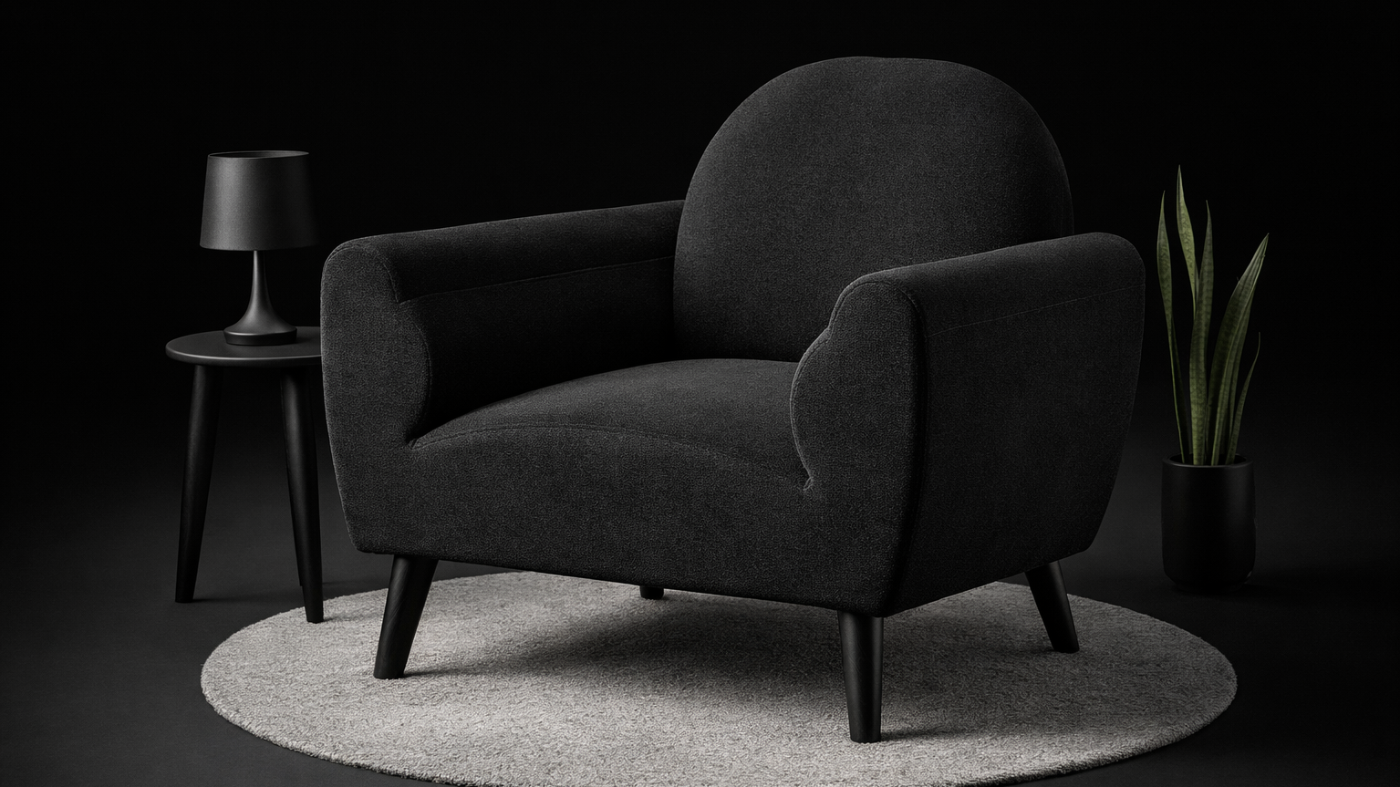 black fabric armchair in dark moody setting