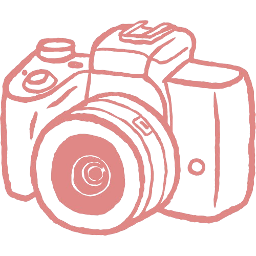 Line drawing of a camera in pink outline on a black background.