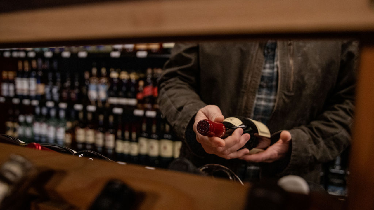 man holding wine bottle