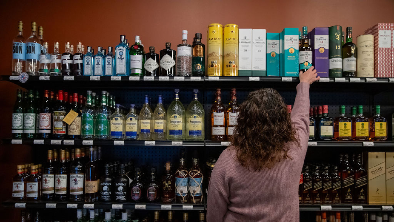 woman reaching for a bottle