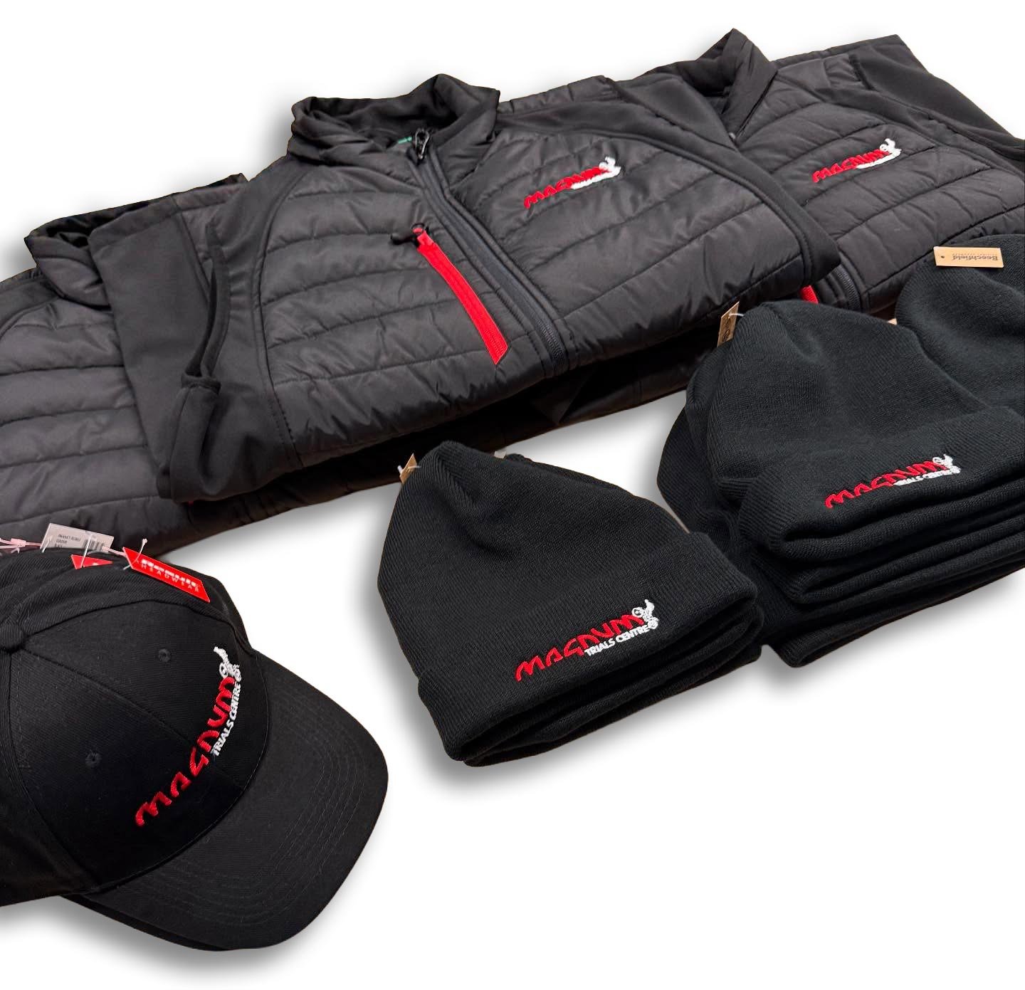 Magnum Trials Centre black beanie, cap and coat merchandise.