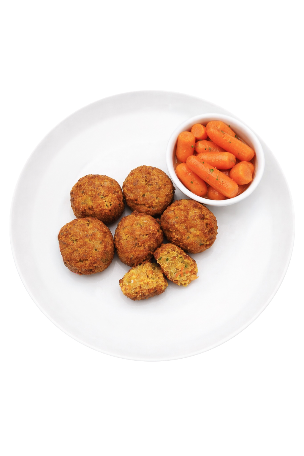 Fried croquettes with broccoli on a white plate