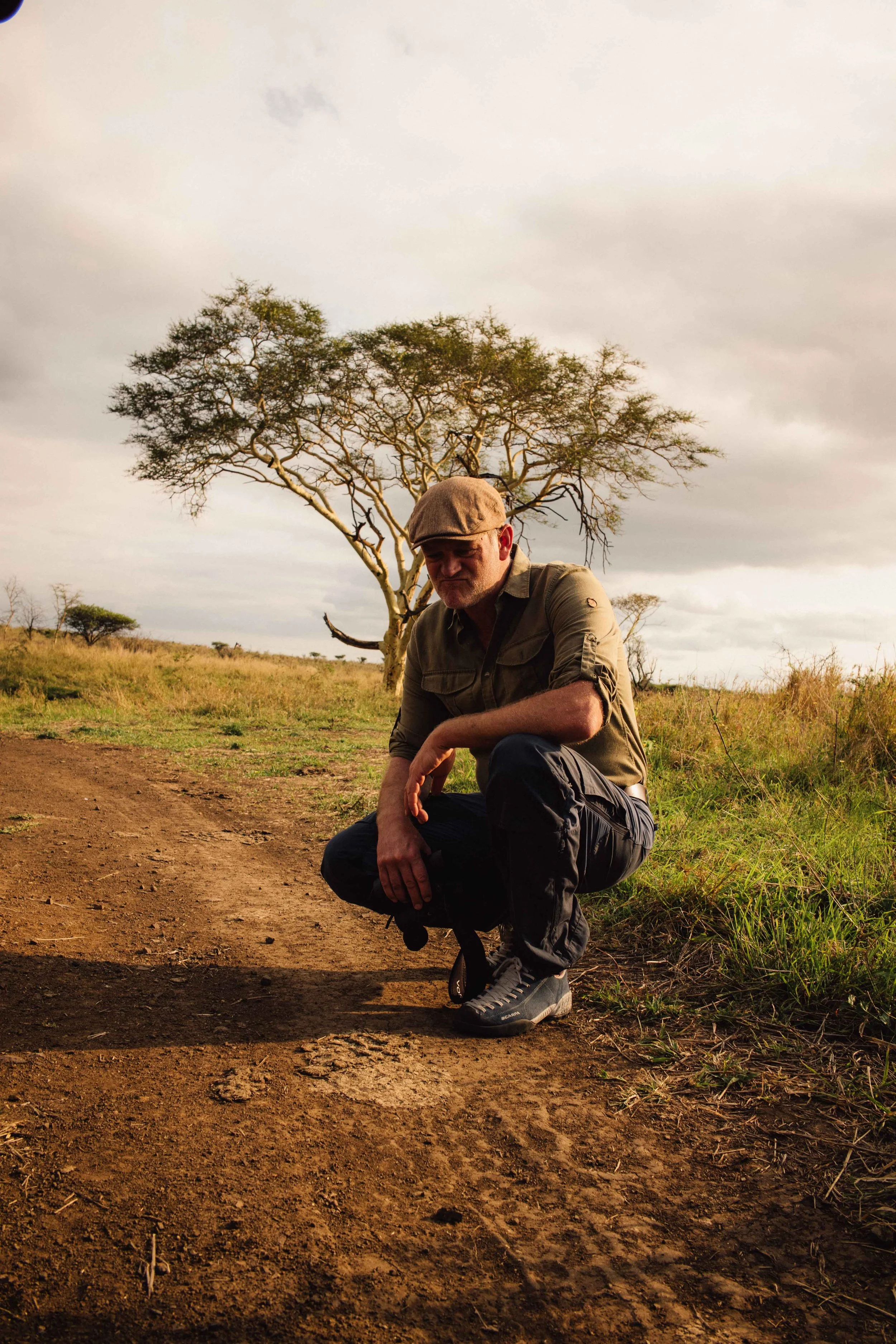 Guest smiling during a guided conservation experience with Honey Guide.