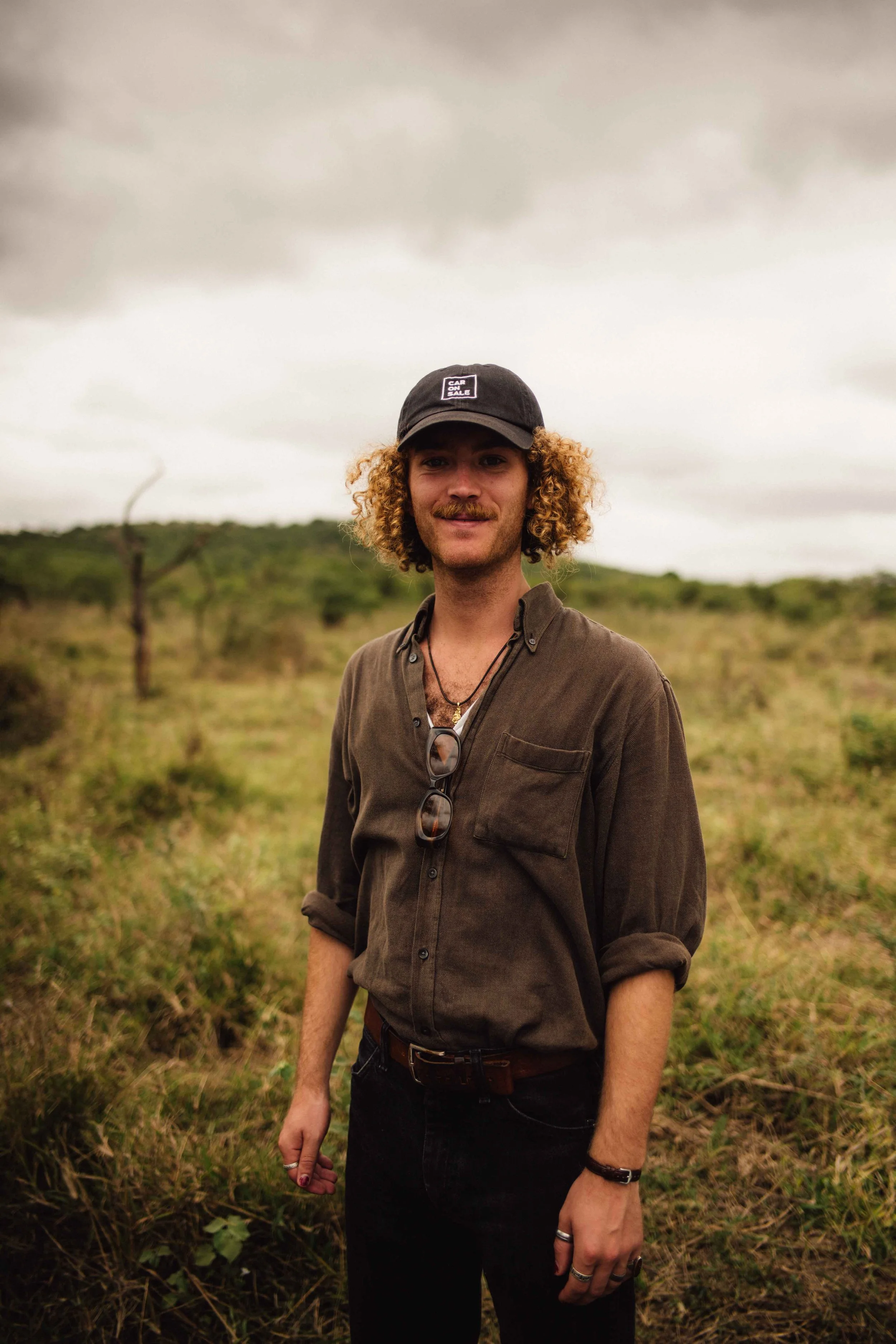Guest photographed at a lookout point during a Honey Guide safari.