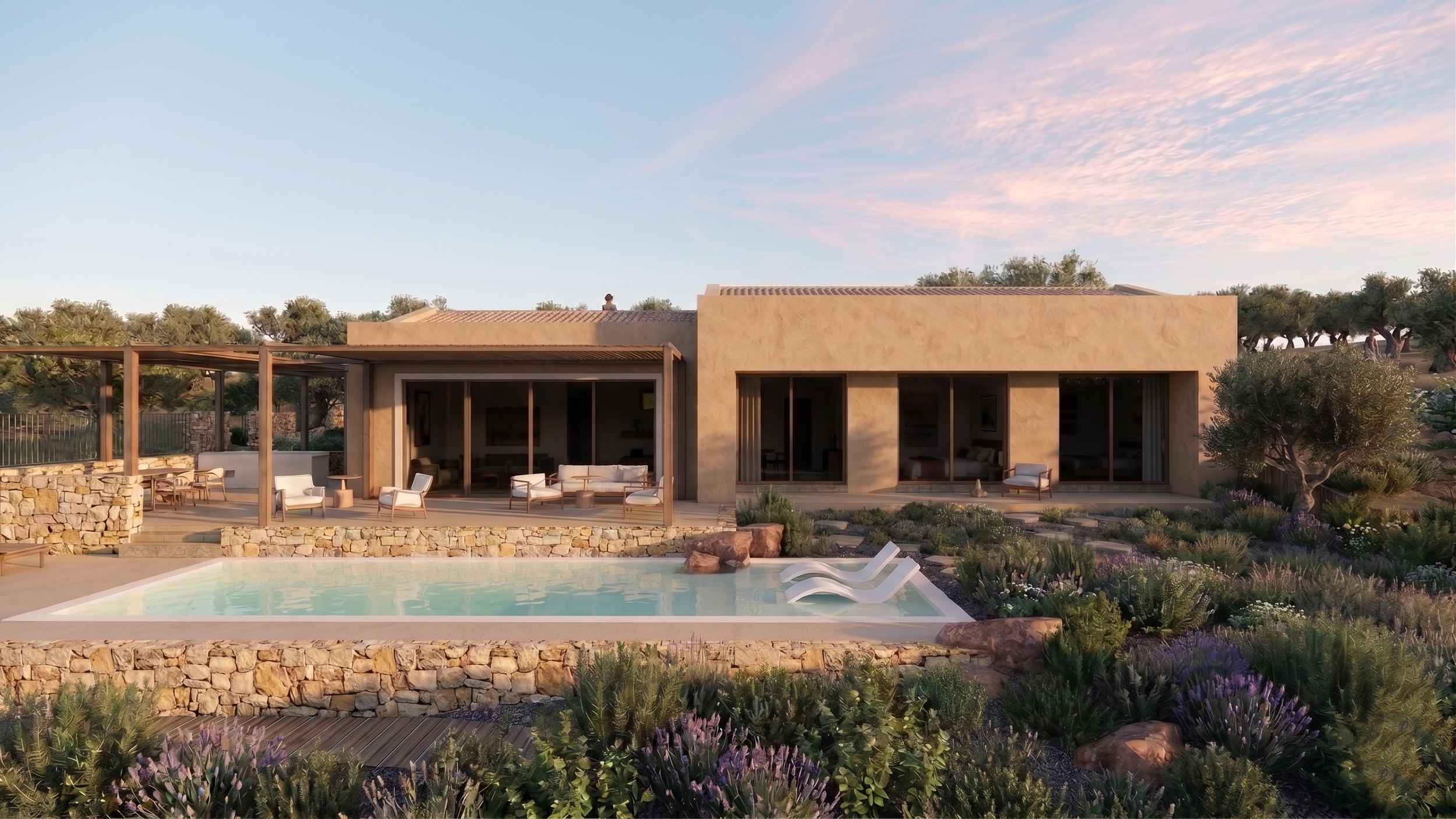 Modern house with an outdoor patio, swimming pool, and surrounding desert landscape at sunset.