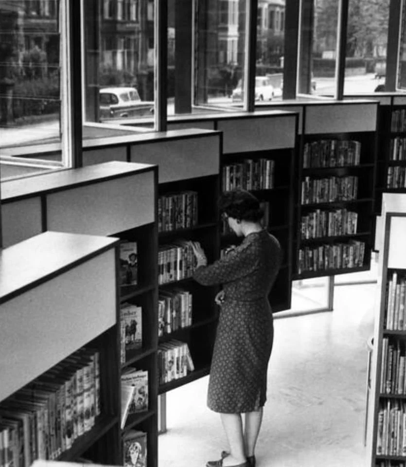 Historic photograph of the original timber bookshelves at Jesmond Library before their removal, documenting the character and craftsmanship that informed the new replacement shelving.