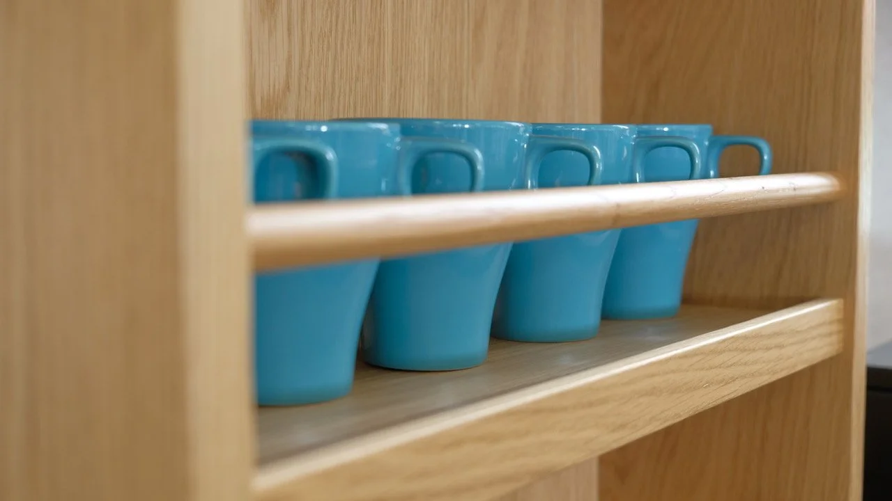 Bespoke oak shelving designed for Jesmond Library, replacing missing original joinery with durable, accessible storage that reflects the character of the historic building.