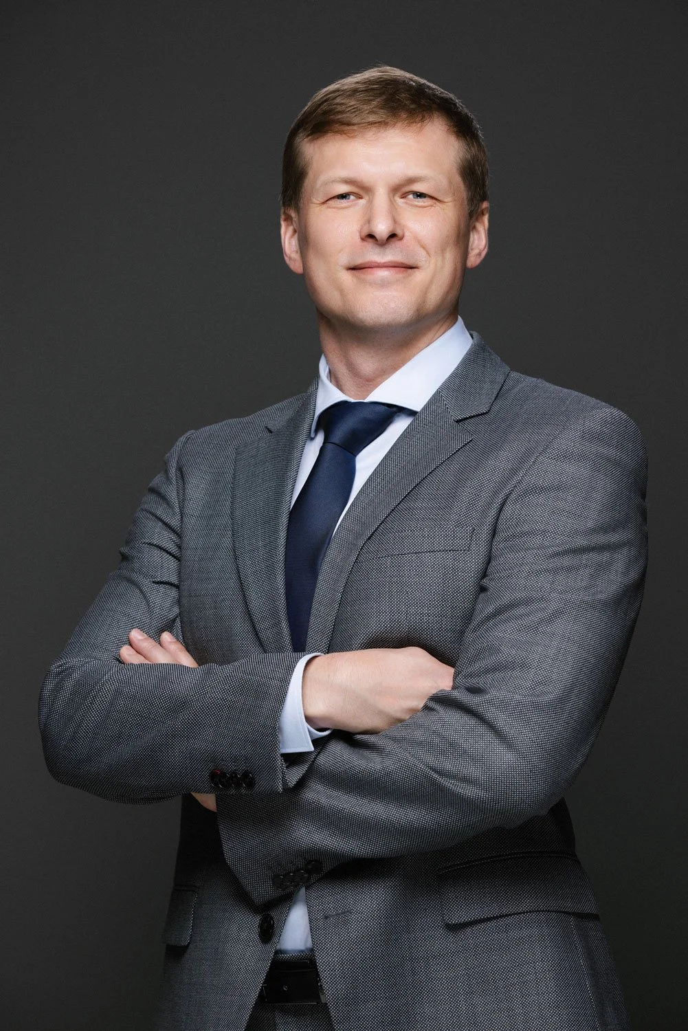 Business leader portrait photographed in natural office environment for corporate profile photography in Dubai.