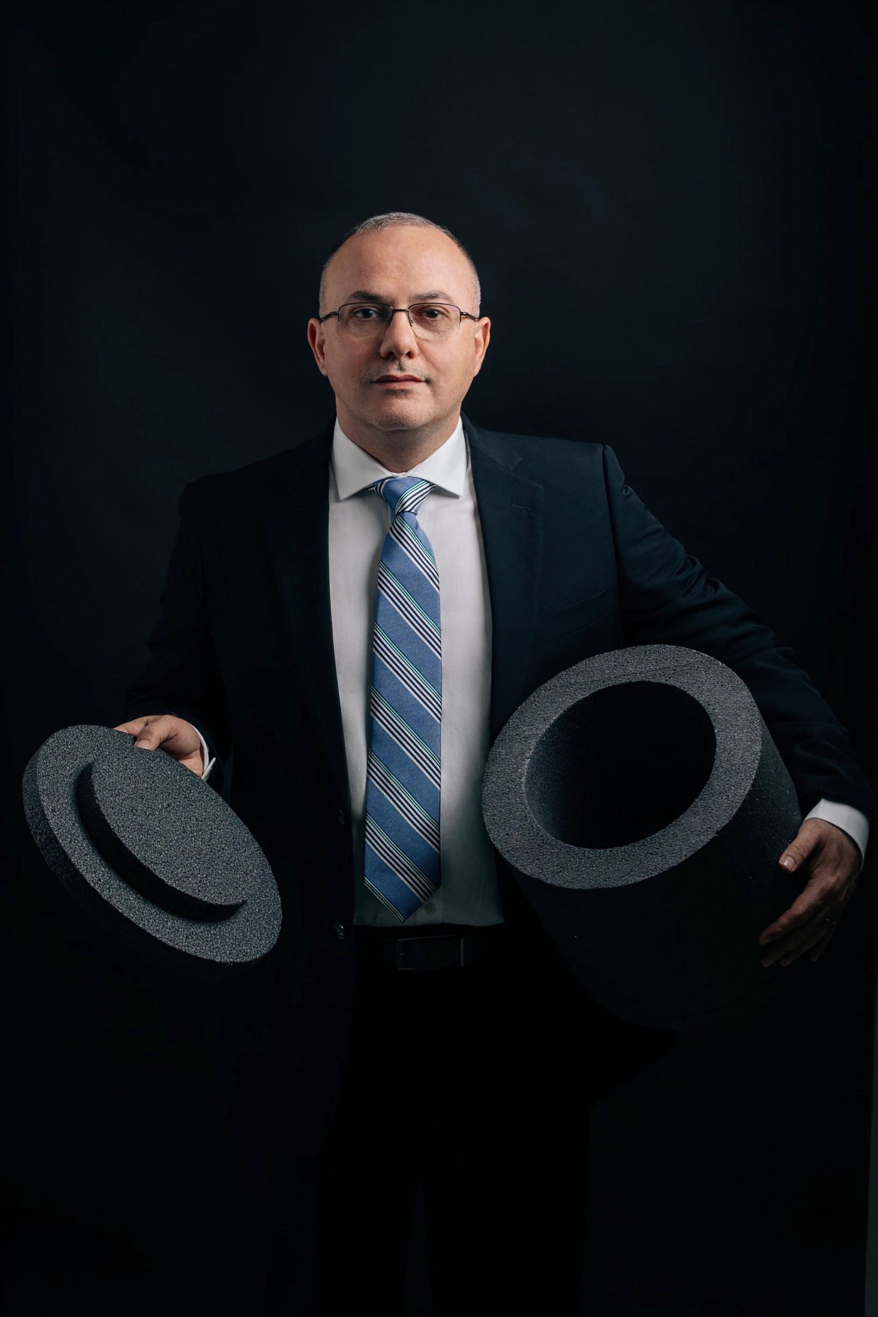 Business leader portrait photographed in natural office environment for corporate profile photography in Dubai.